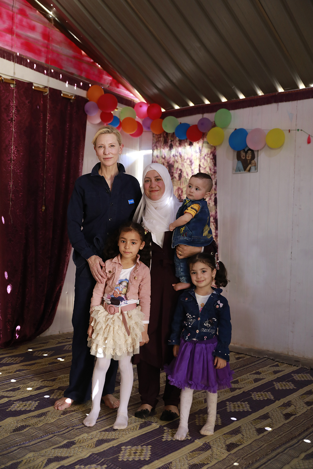 UNHCR Goodwill Ambassador Cate Blanchett at the home of Alaa Al-Hamadi, a refugee from Syria living in Zaatari refugee camp, Jordan with her children Sara, 7 years old, Kinana, 4 years old, and Omar, 10 months old