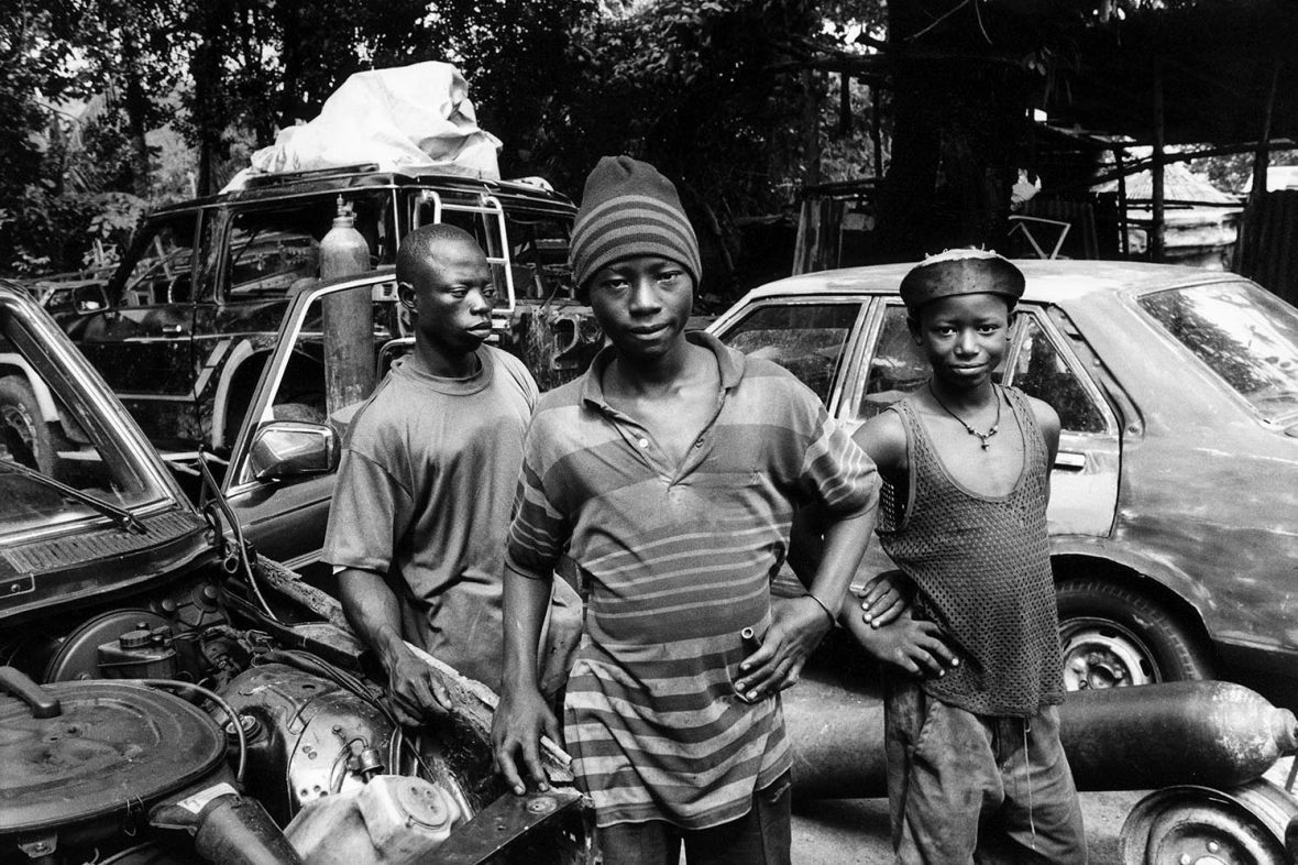Recently demobilised child soldiers training to become mechanics at a garage in Makeni. Children caught up in the fighting were taught new skills in rehabilitation programmes across the country following the peace accord, which many found it difficult to stick with.