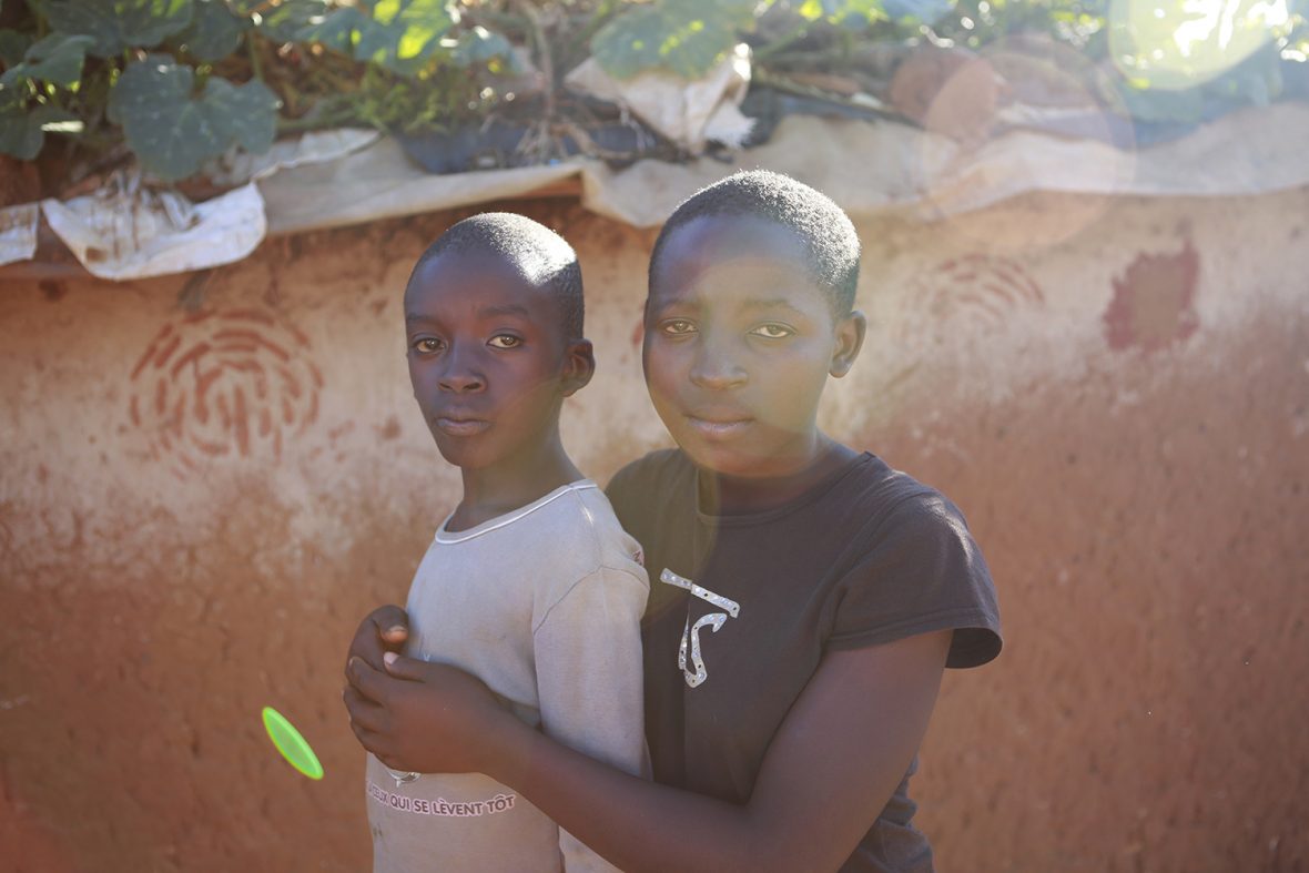 Veronice Umuhoza, 15, and her younger brother Mpuhwezimana Ejide, 8, are refugees from Democratic Republic of the Congo, who arrived in Nakivale Refugee Settlement in 2015 as unaccompanied minors. They spent three years living in the reception centre, but since 2018, have lived with foster parents.
