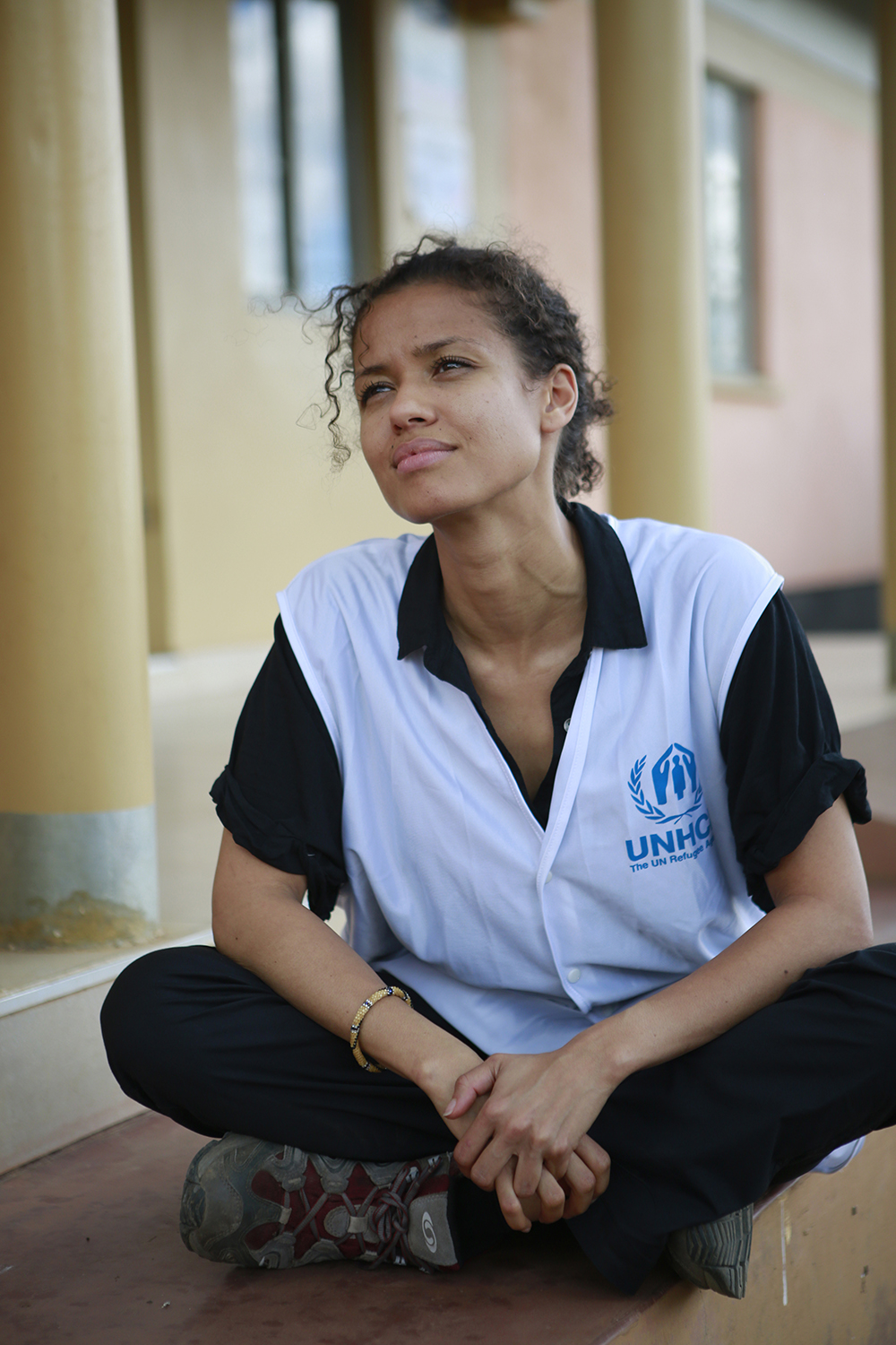 UNHCR Supporter Gugu Mbatha-Raw listens to music sung by Congolese refugees in Rwamanja Refugee Settlement, Uganda